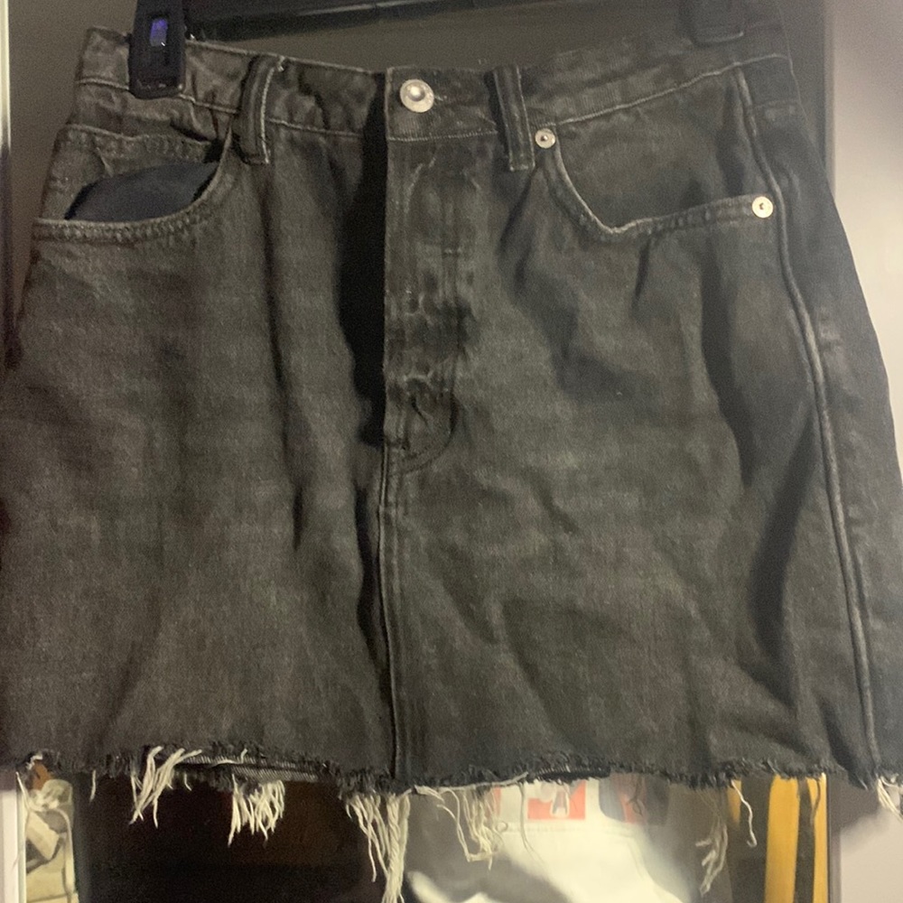 Black denim skirt with adjustable back strap!! cutest look for any occasion!!